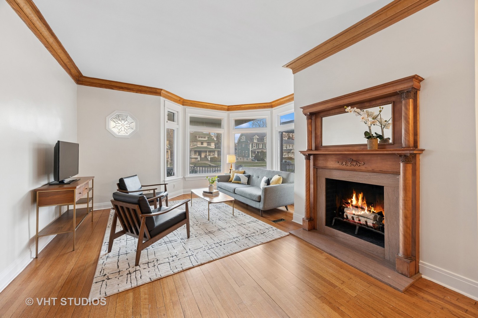 309 Wesley Avenue Oak Park, IL 60302 - Photo 4 of 56 a living room with furniture and a fireplace