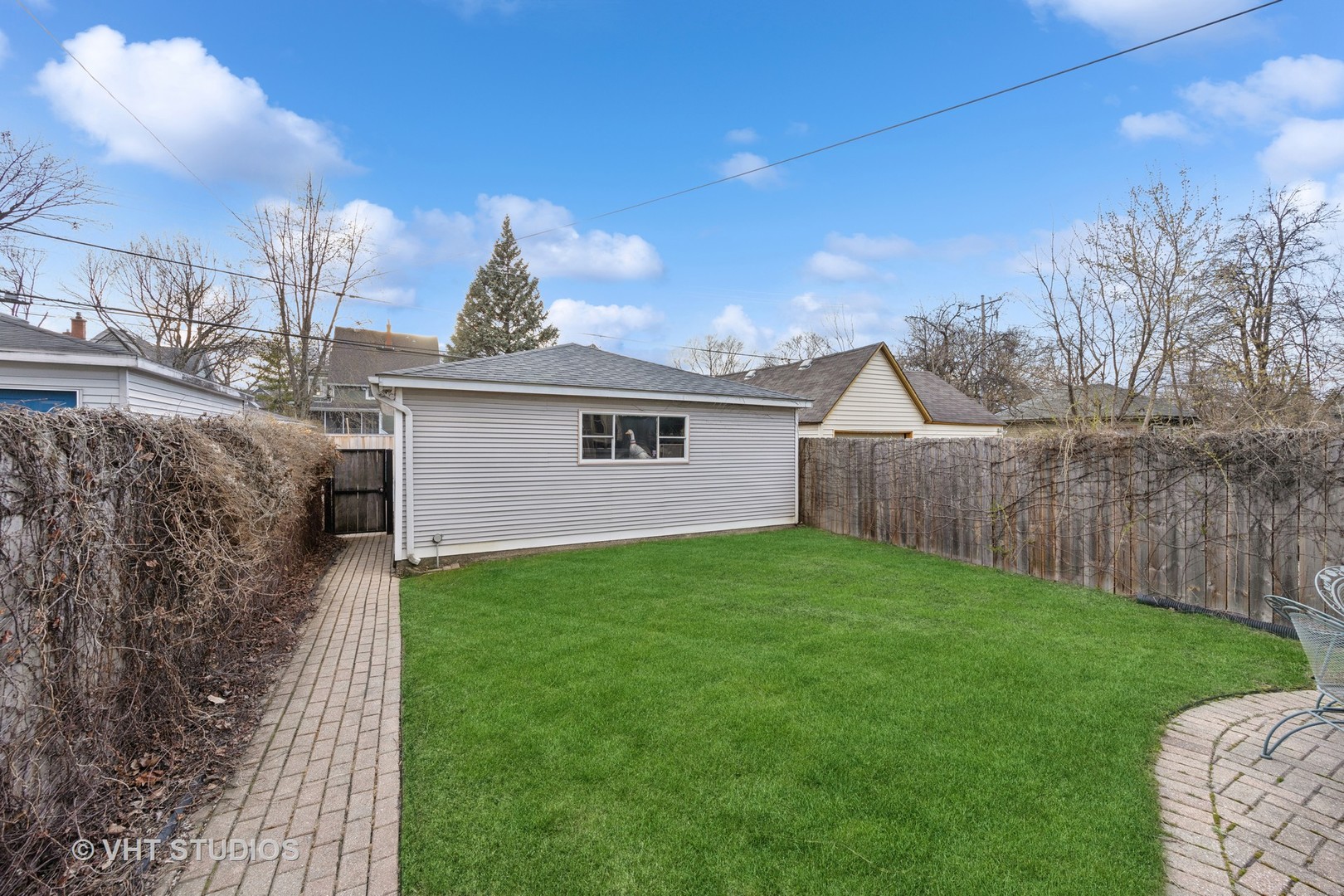 309 Wesley Avenue Oak Park, IL 60302 - Photo 56 of 56 a view of a backyard with plants and a large tree