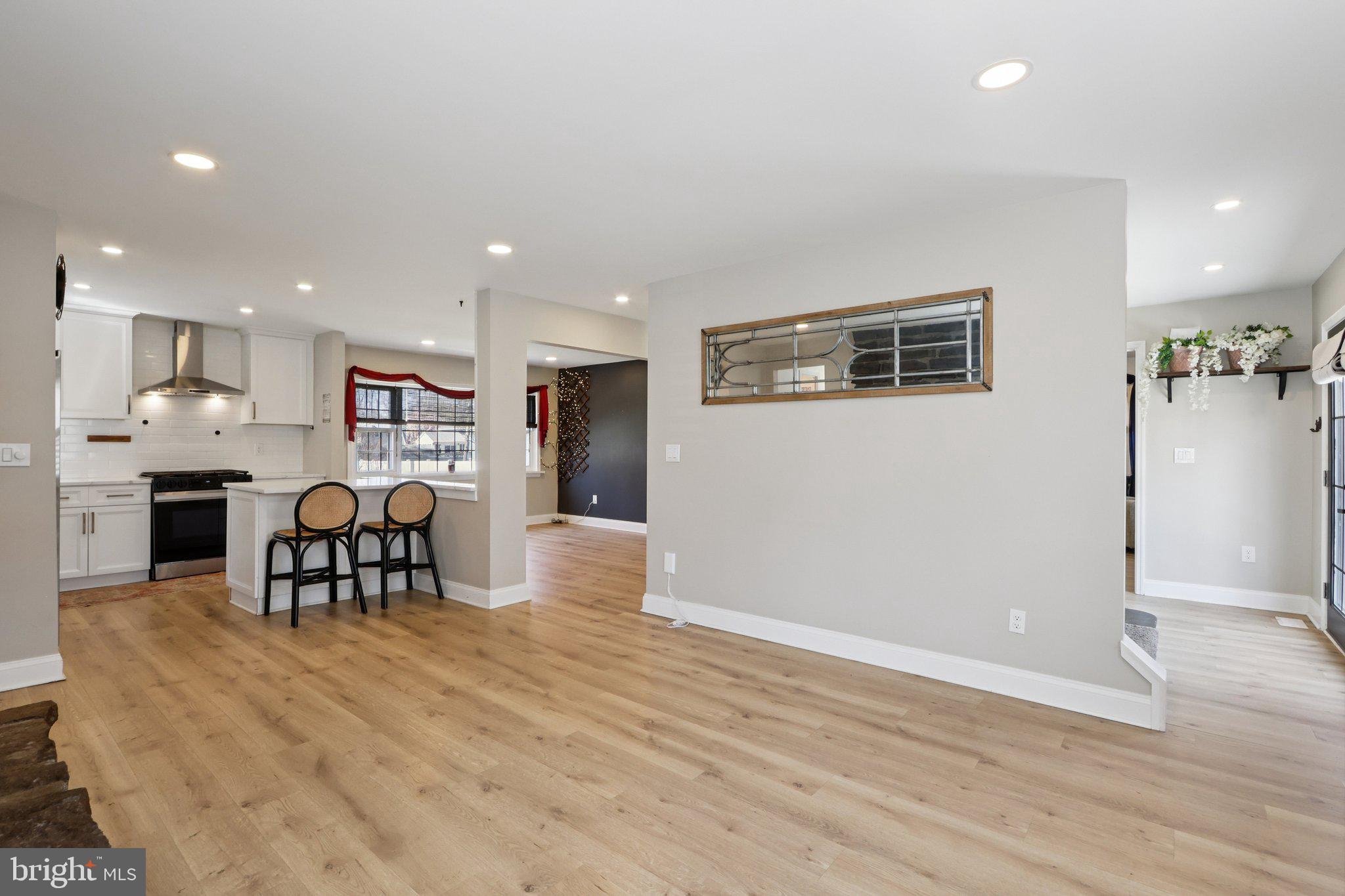 351 Merrick Road Robbinsville, NJ 08691 - Photo 25 of 69 a living room with furniture and kitchen view