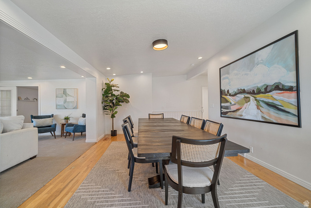 4426 South 3035 East Holladay, UT 84124 - Photo 11 of 49 Dining room featuring recessed lighting, a textured ceiling, and light wood-style flooring