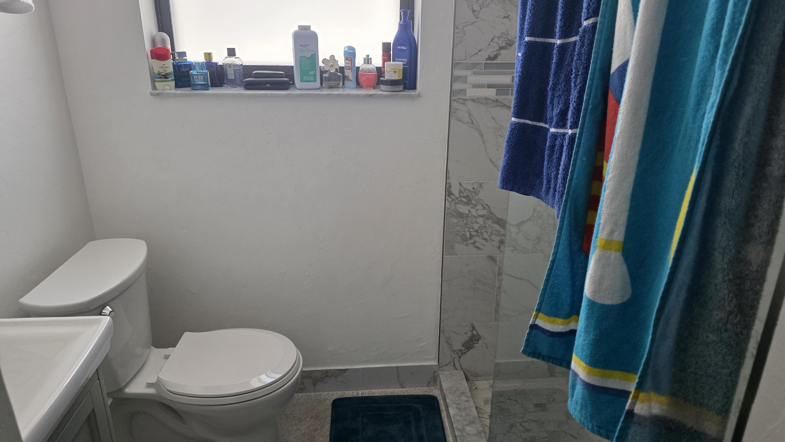 117 North 5th Street Fort Pierce, FL 34950 - Photo 25 of 30 a bathroom with a toilet and a shower