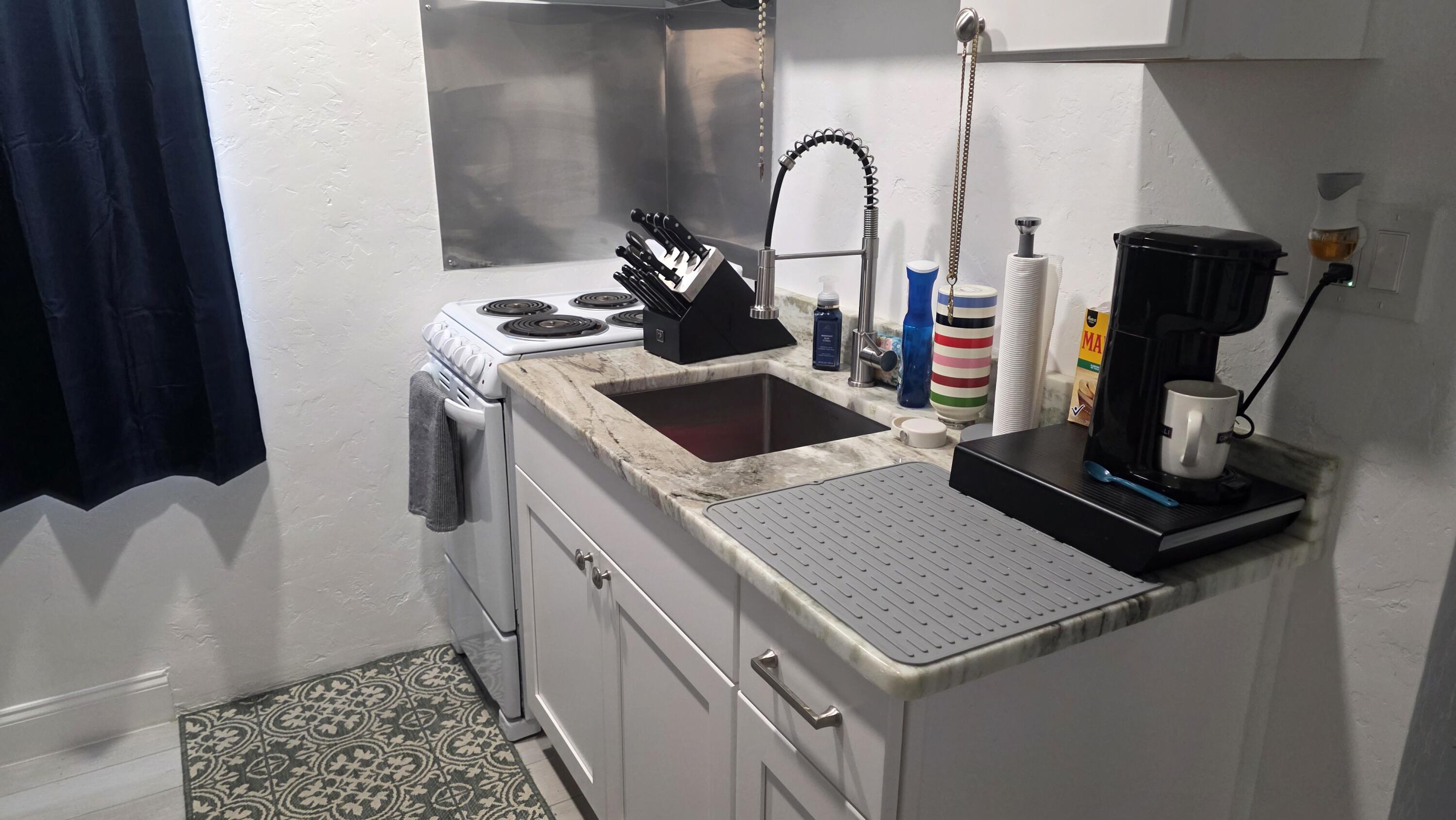 117 North 5th Street Fort Pierce, FL 34950 - Photo 26 of 30 a bathroom with a sink and a mirror
