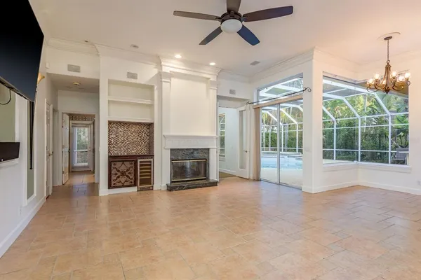 a kitchen with kitchen island stainless steel appliances a sink a counter top space and cabinets