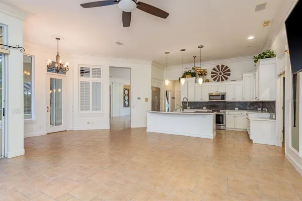a kitchen with a sink stove and cabinets