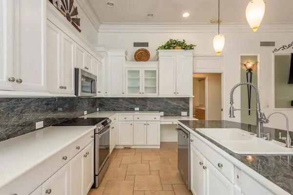 a bathroom with a granite countertop sink mirror and bathtub