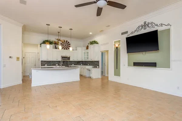a view of a livingroom with a fireplace and cabinet