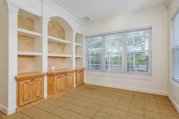a spacious bathroom with a granite countertop sink mirror and a shower