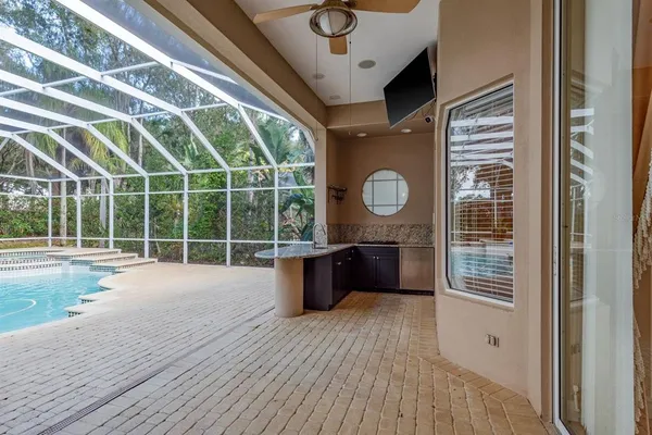 a view of a roof deck with table and chairs and wooden floor