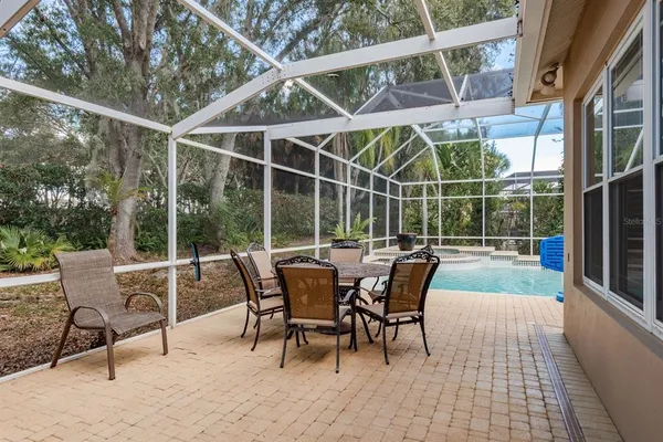 a view of a livingroom with furniture and a window