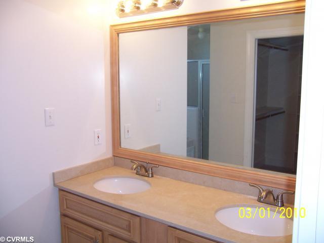 13430 Carters Way Road Chesterfield, VA 23838 - Photo 7 of 12 Master Bath - Master bathroom with new maple double vanity with limestone counters. Large walk-in closet and separate toilet area.