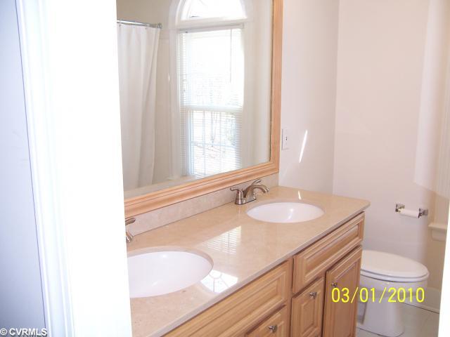 13430 Carters Way Road Chesterfield, VA 23838 - Photo 9 of 12 Other - Upstairs hall bath with new maple double vanity and limestone counter top.
