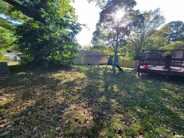 a view of backyard with green space