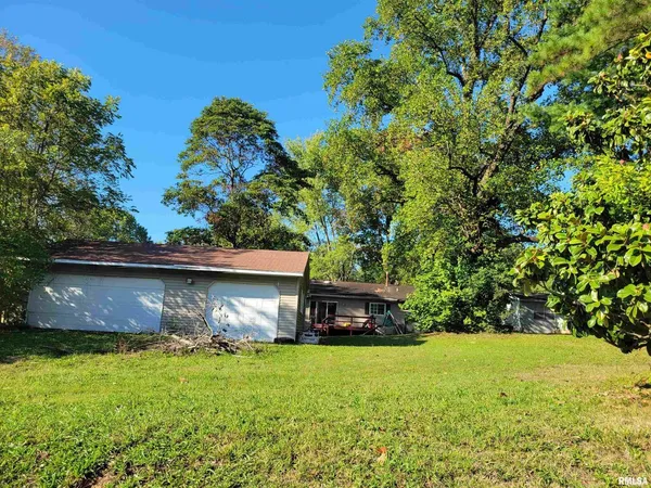 a view of a back yard of the house
