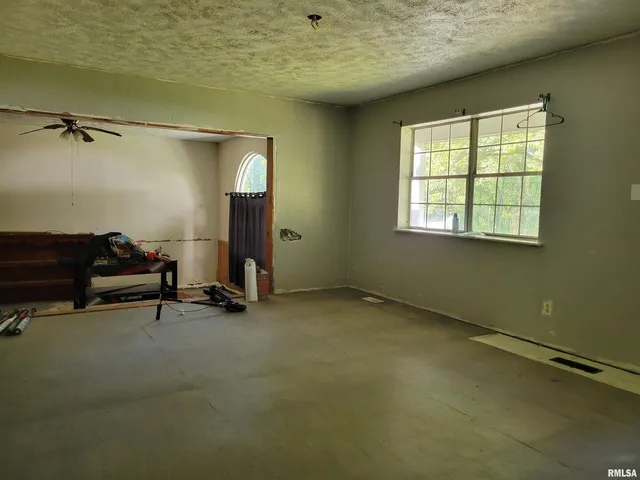 an empty room with windows