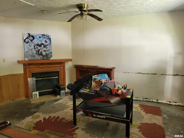 a bedroom with furniture and a fireplace