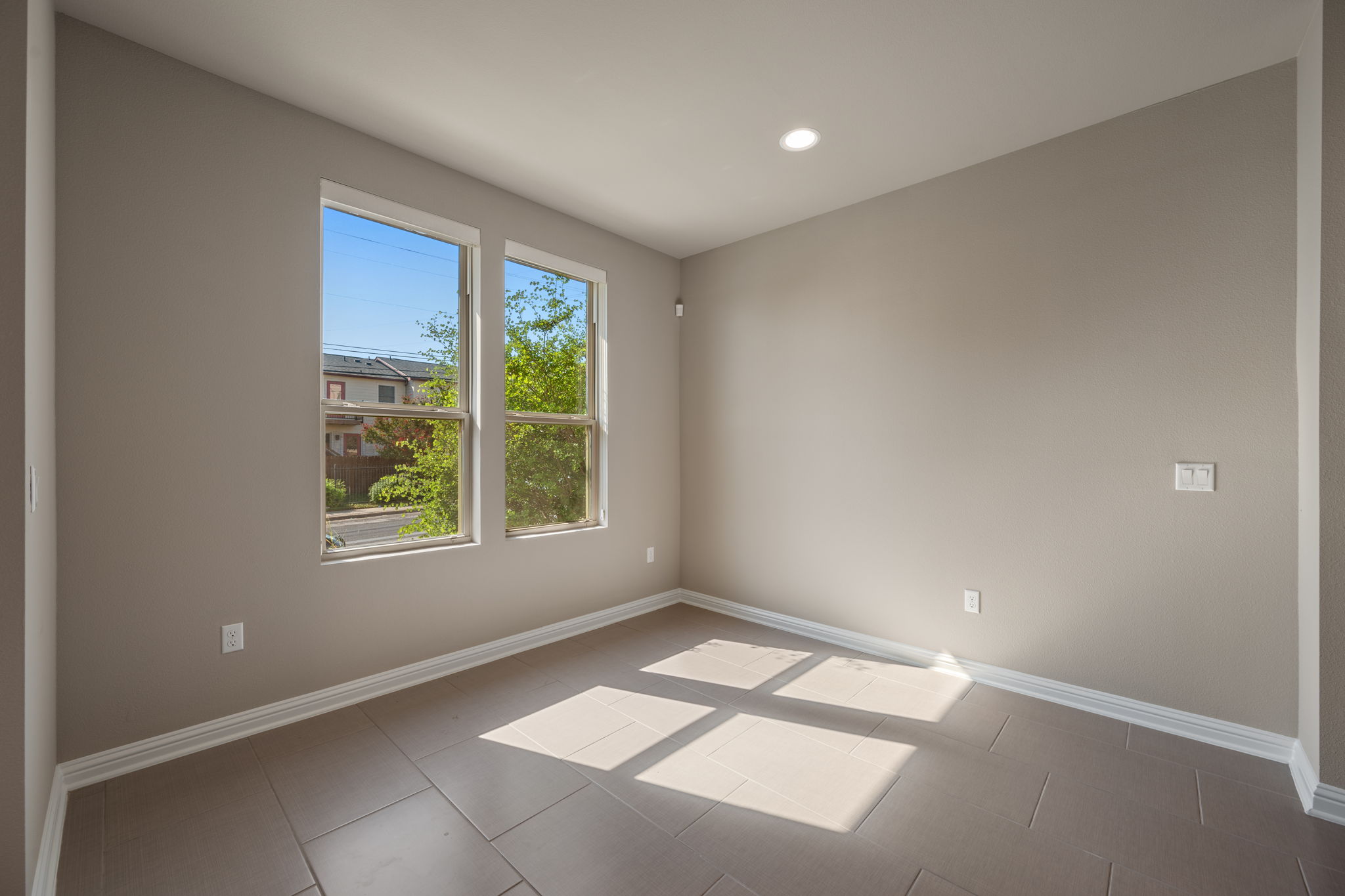6814 East Riverside Drive, Unit 55 Austin, TX 78741 - Photo 11 of 31 Spare room with recessed lighting and tile patterned flooring