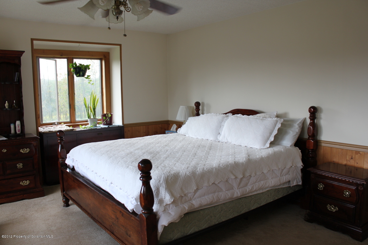 190 North Barnes Road Moscow, PA 18444 - Photo 7 of 25 a bedroom with a bed and window