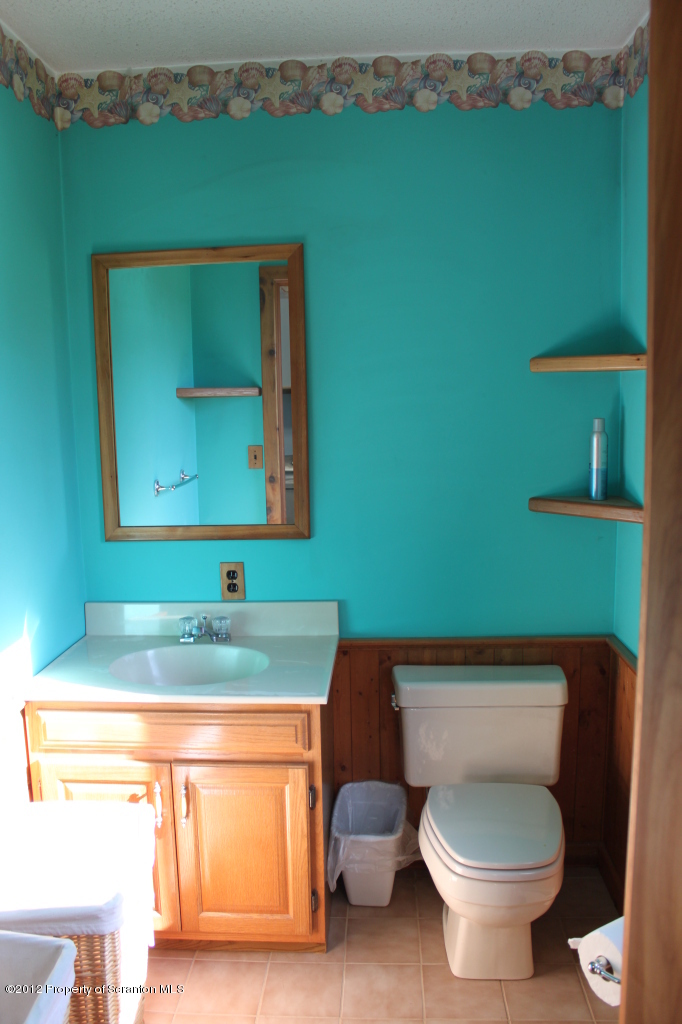 190 North Barnes Road Moscow, PA 18444 - Photo 8 of 25 a bathroom with a toilet sink and mirror