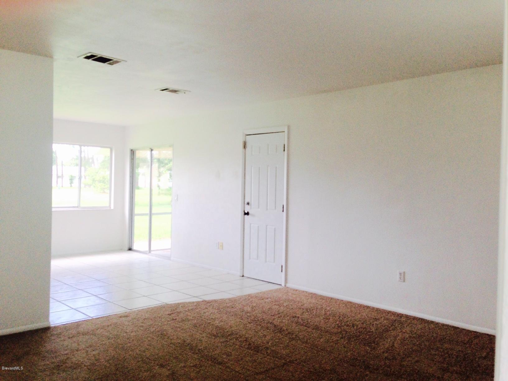 1220 Freil Road Northeast Palm Bay, FL 32905 - Photo 4 of 11 LIVING ROOM TO DINING