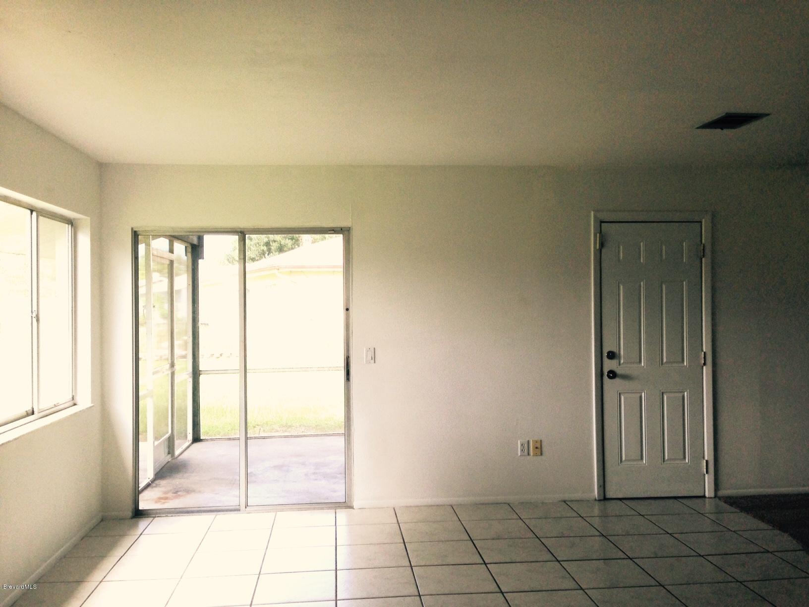 1220 Freil Road Northeast Palm Bay, FL 32905 - Photo 8 of 11 DINING ROOM TO PORCH