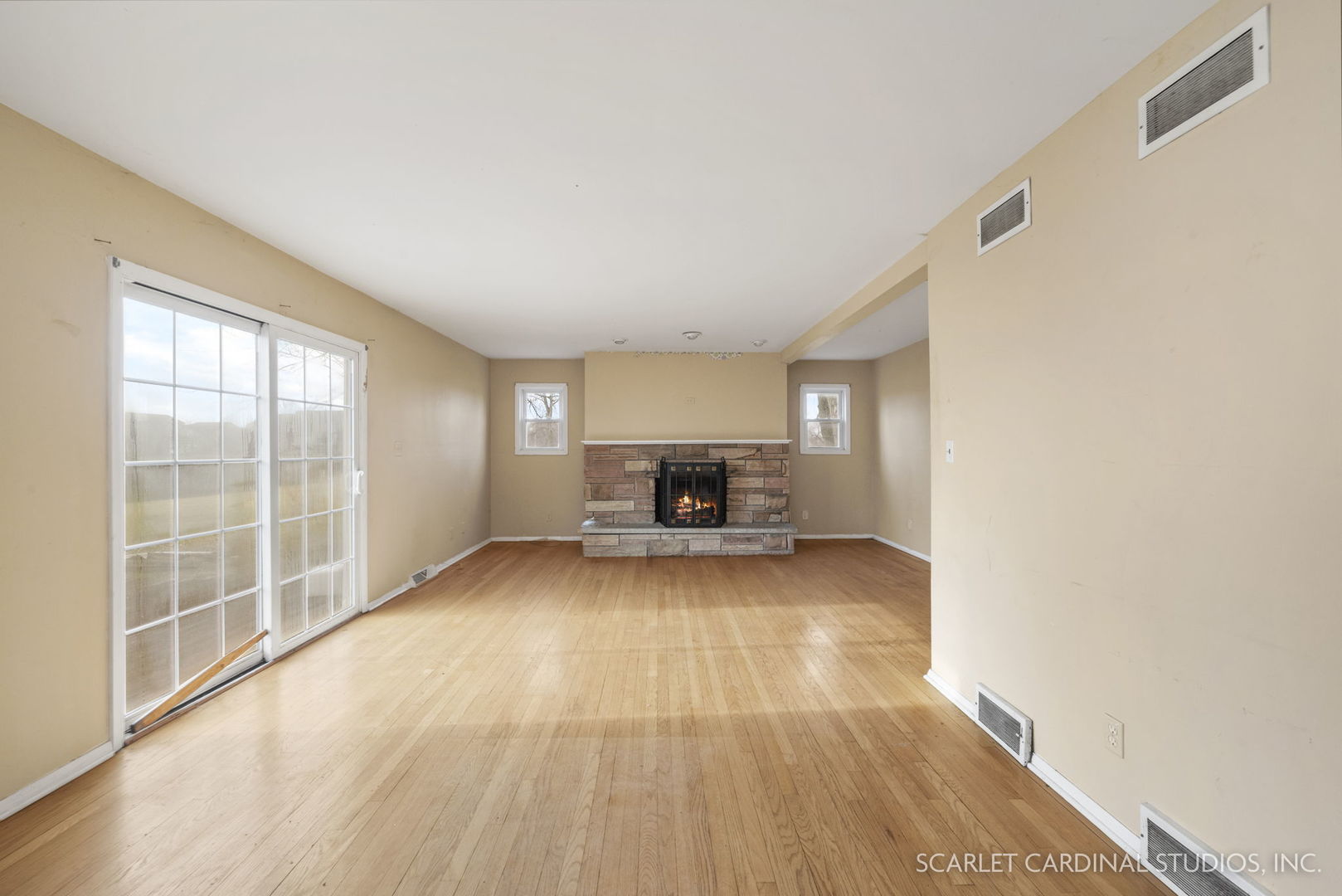 2151 Sheffer Road Aurora, IL 60502 - Photo 6 of 16 a view of empty room with wooden floor and fan