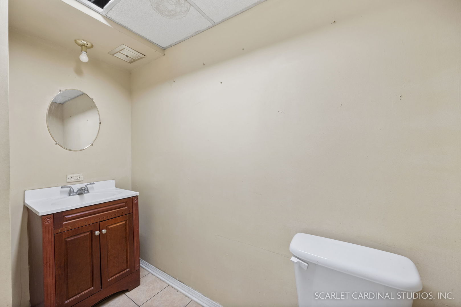 2151 Sheffer Road Aurora, IL 60502 - Photo 7 of 16 a bathroom with a toilet sink vanity and mirror