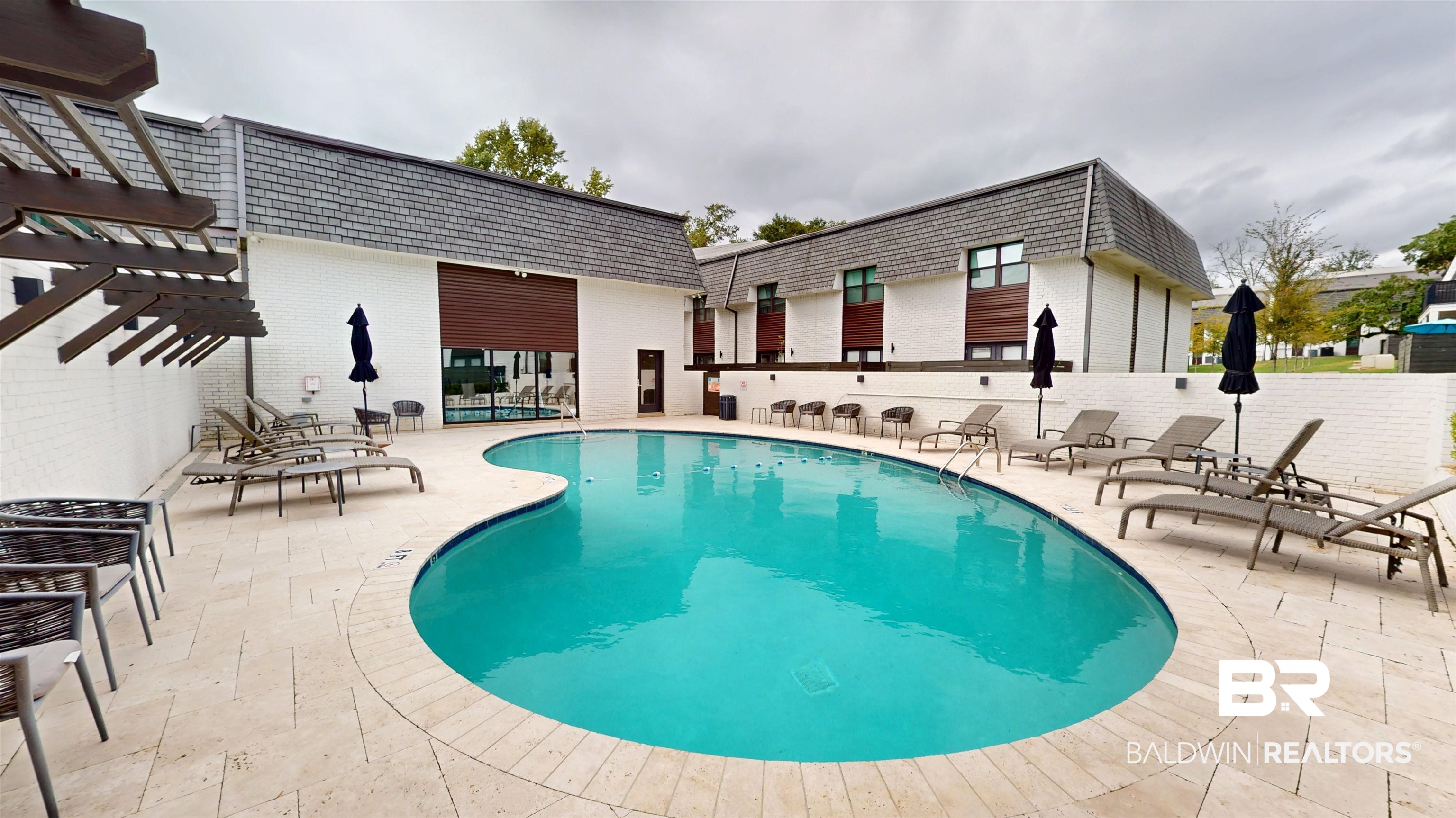 3655 Old Shell Road, Unit 219 Mobile, AL 36608 - Photo 18 of 25 Community pool featuring a pergola and a patio area