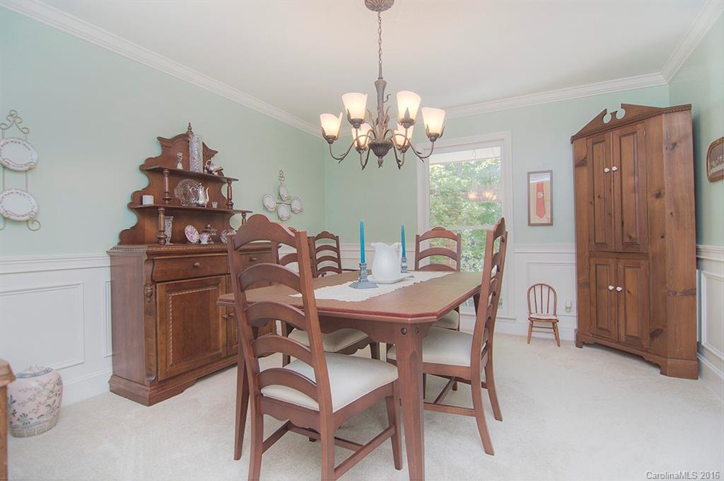 3001 Planters Ridge Road Charlotte, NC 28270 - Photo 11 of 24 a view of a dining room with furniture and chandelier
