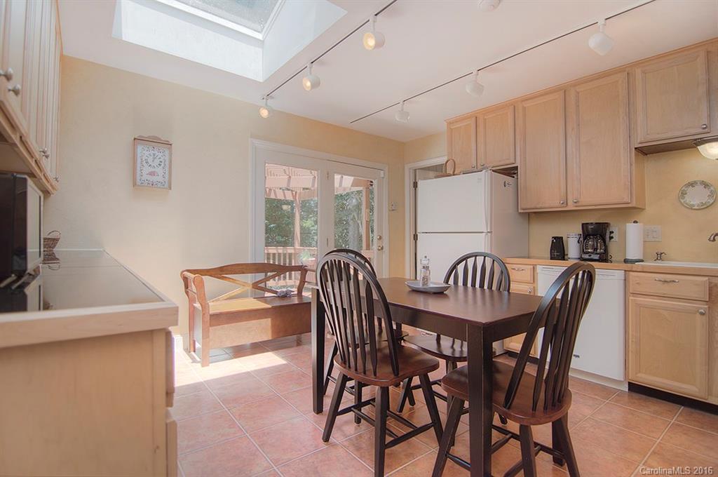 3001 Planters Ridge Road Charlotte, NC 28270 - Photo 12 of 24 a kitchen with granite countertop a dining table chairs and a refrigerator