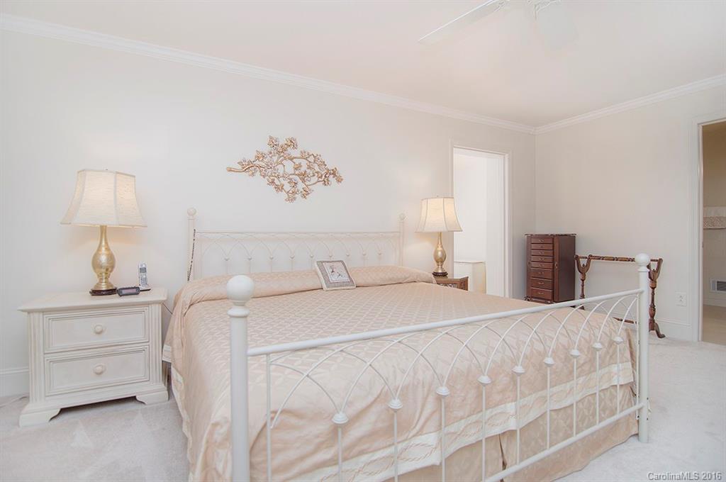 3001 Planters Ridge Road Charlotte, NC 28270 - Photo 14 of 24 a bedroom with a bed and a lamp on dresser