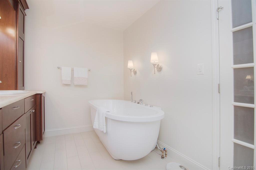 3001 Planters Ridge Road Charlotte, NC 28270 - Photo 19 of 24 a bathroom with a sink a mirror and a toilet