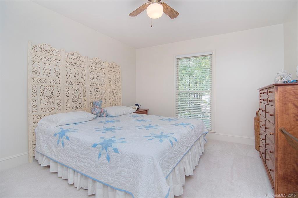 3001 Planters Ridge Road Charlotte, NC 28270 - Photo 22 of 24 a bedroom with a bed and a chandelier