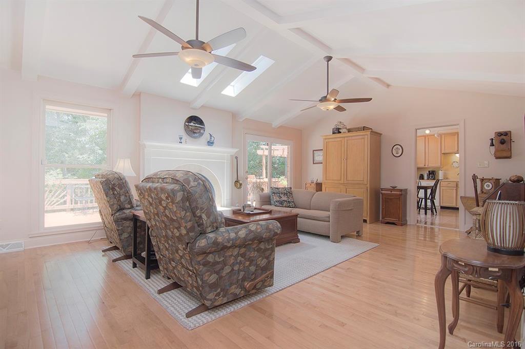3001 Planters Ridge Road Charlotte, NC 28270 - Photo 10 of 24 a living room with furniture a fireplace and a chandelier