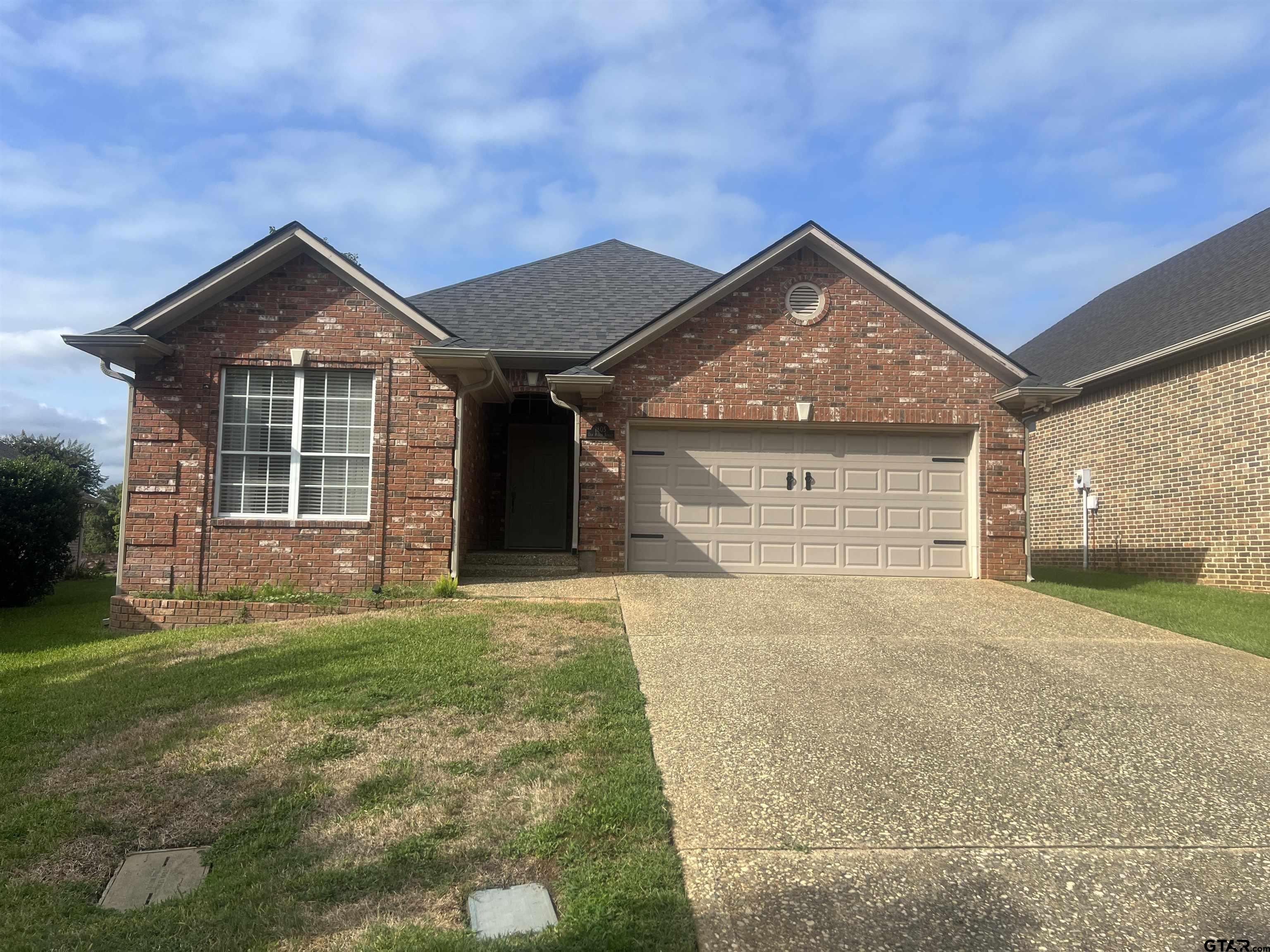 1805 Oak Ridge Street Hideaway, TX 75771 - Photo 1 of 15 a view of a house with backyard and garden