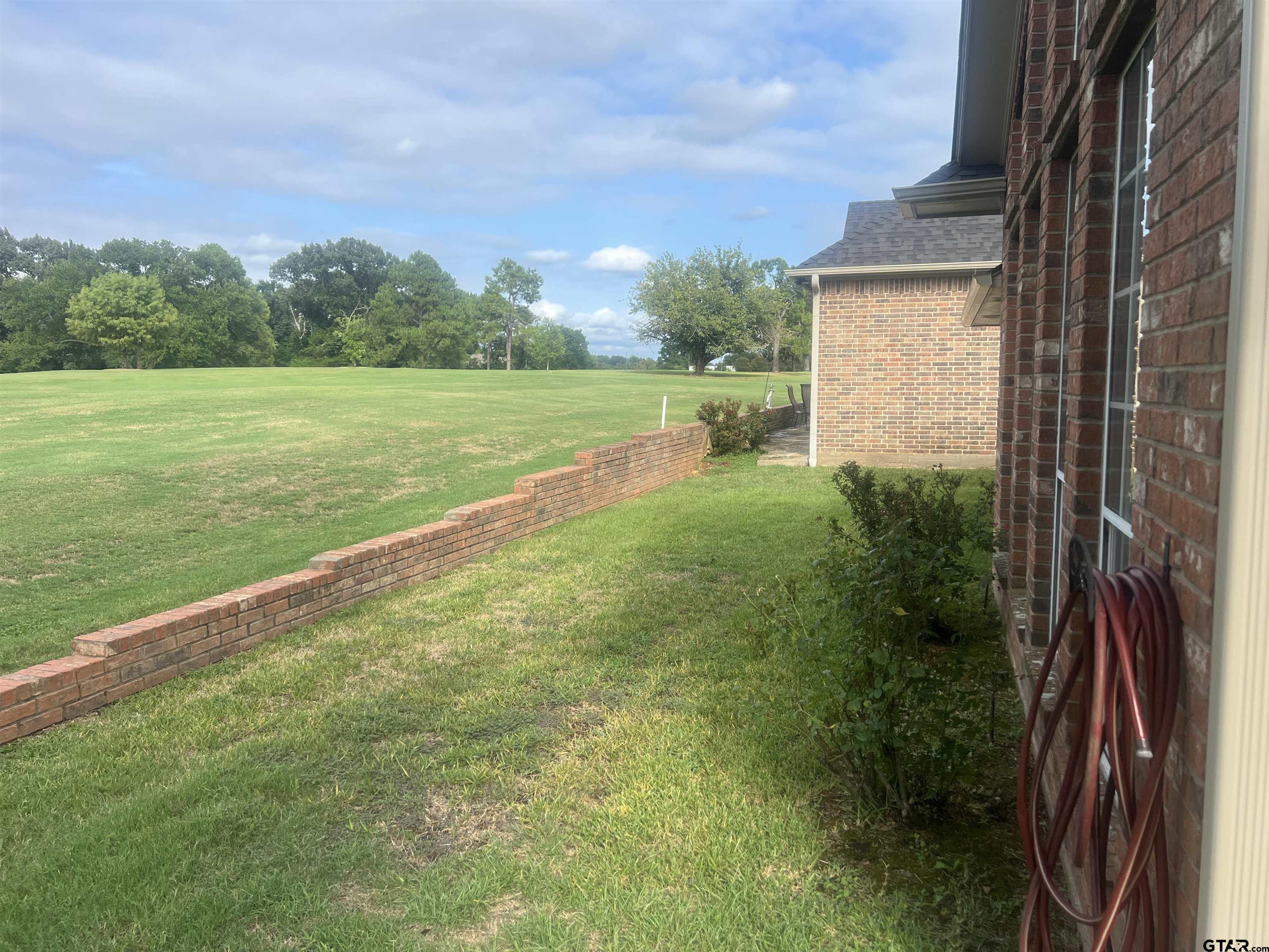 1805 Oak Ridge Street Hideaway, TX 75771 - Photo 14 of 15 a view of a backyard