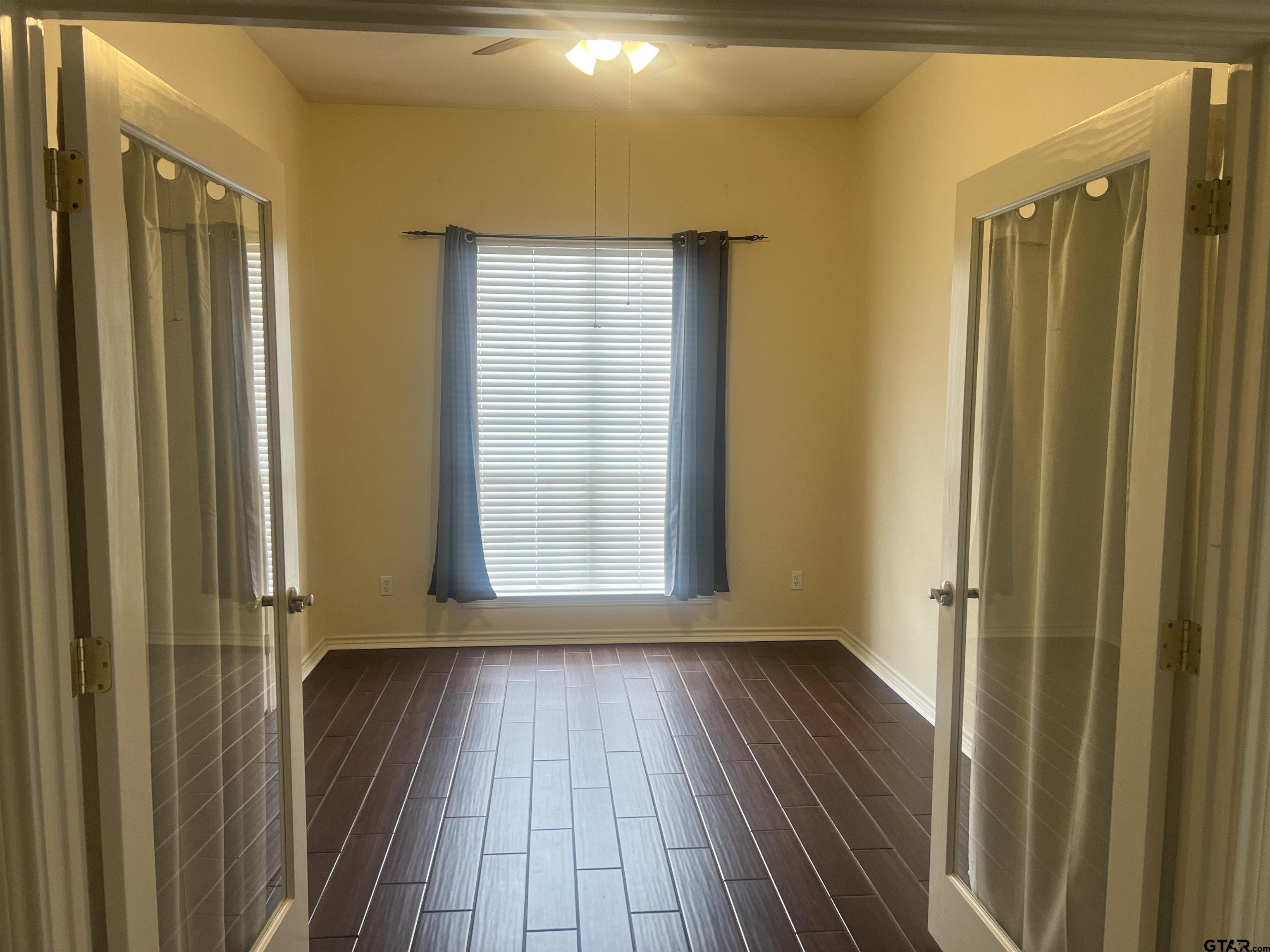 1805 Oak Ridge Street Hideaway, TX 75771 - Photo 15 of 15 a view of a hallway with wooden floor