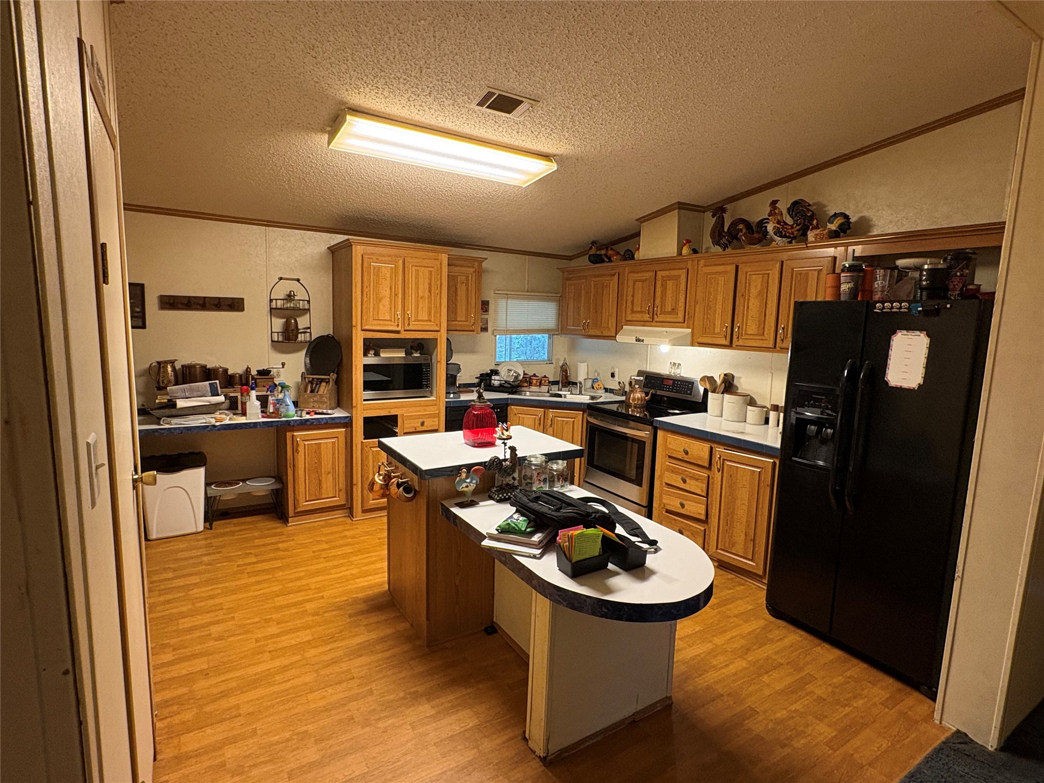 219 High View Ranch Drive Cedar Creek, TX 78612 - Photo 16 of 18 a kitchen with a sink appliances and cabinets