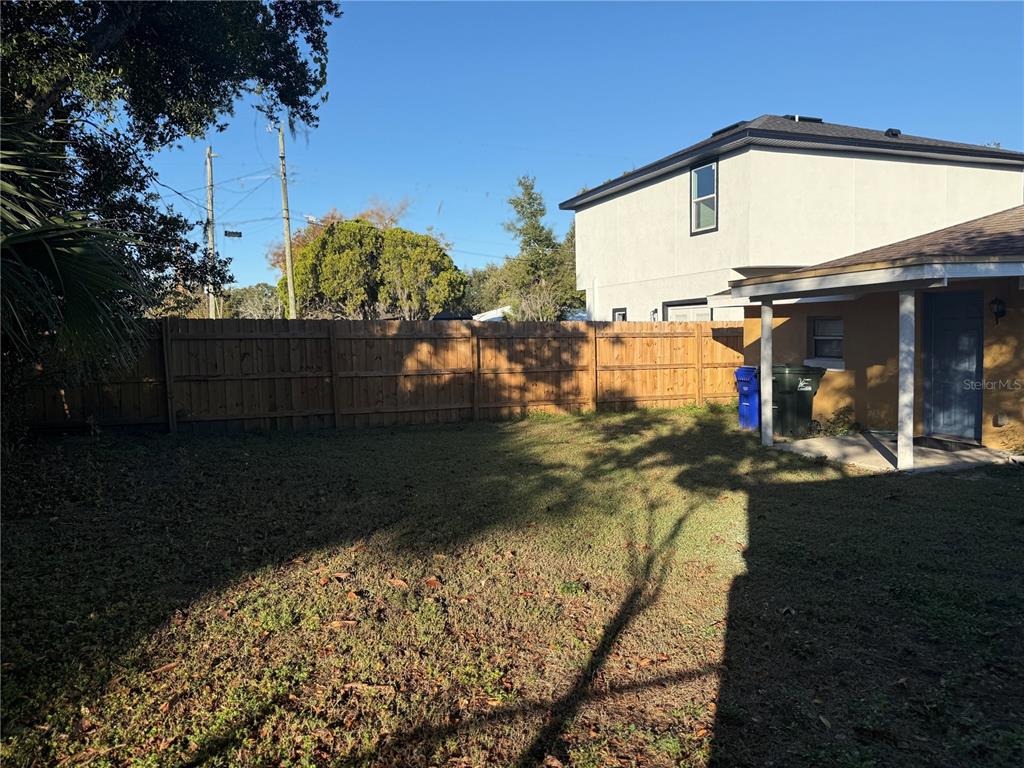 720 West 12th Street Lakeland, FL 33805 - Photo 12 of 12 a view of a house with backyard and sitting area
