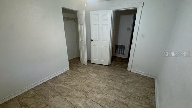 720 West 12th Street Lakeland, FL 33805 - Photo 7 of 12 an empty room with a door
