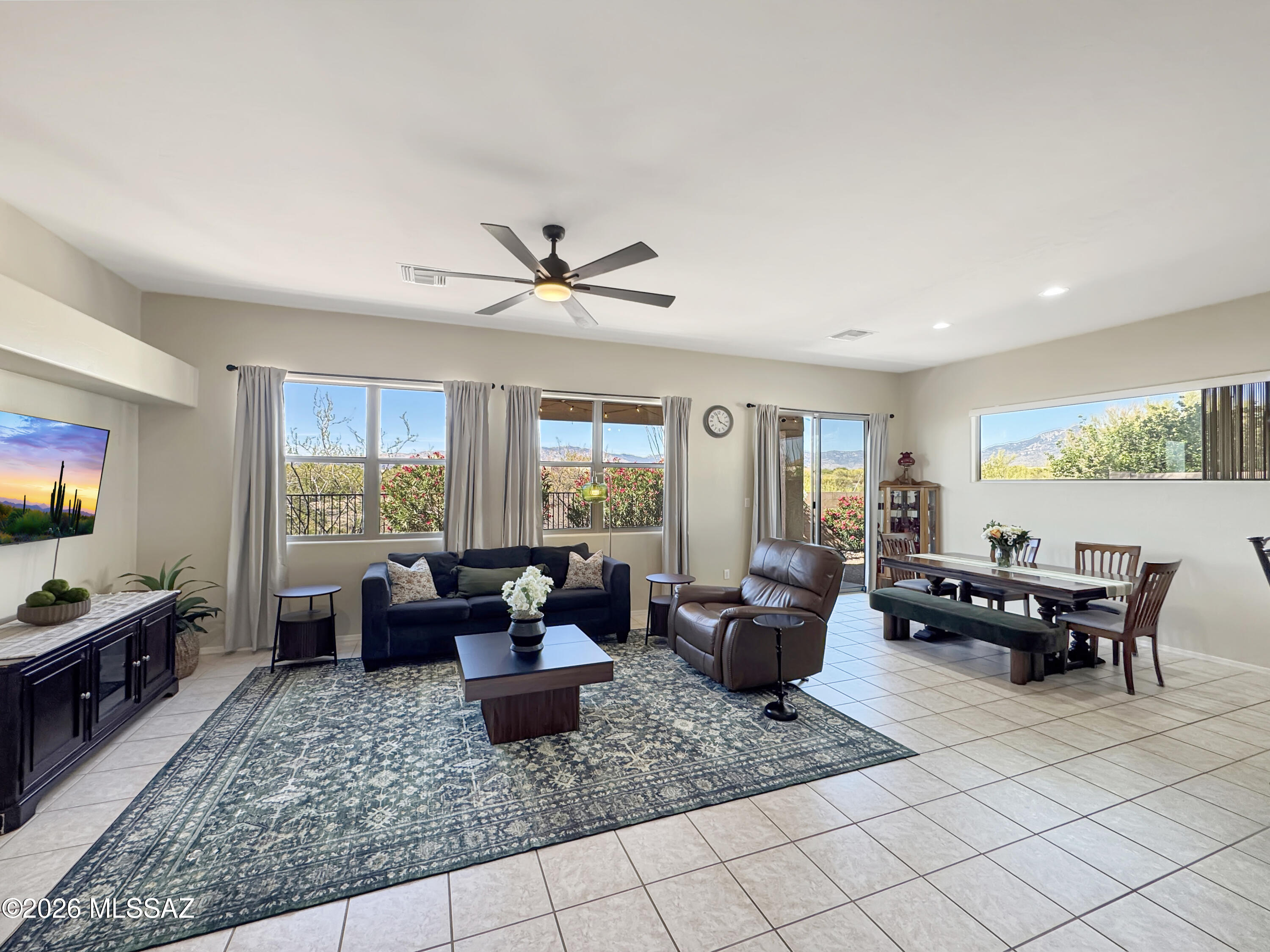 10835 South Heart Break Ridge Place Vail, AZ 85641 - Photo 10 of 49 a living room with furniture and a flat screen tv