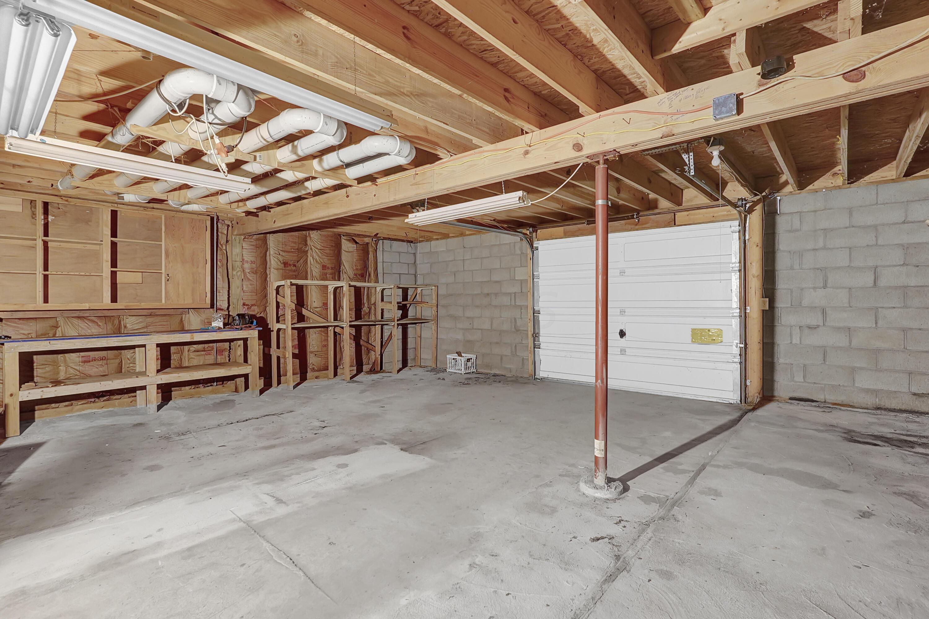 6865 Revenge Road Southwest Lancaster, OH 43130 - Photo 29 of 35 Workshop on the lower level with garage door to outside.