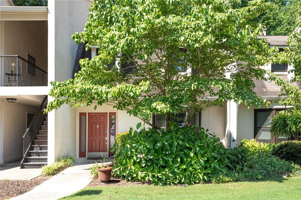 1705 Huntingdon Chase Atlanta, GA 30350 - Photo 1 of 1 a house that has a tree in front of the house