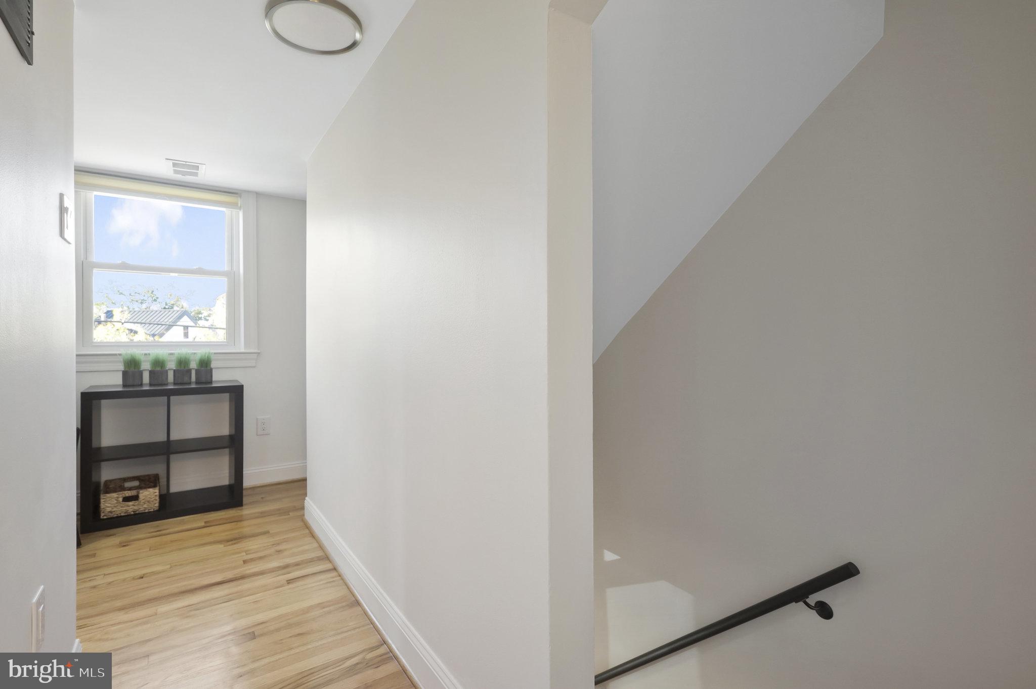116 Commerce Street Alexandria, VA 22314 - Photo 14 of 50 Bright and airy hallway retreat.