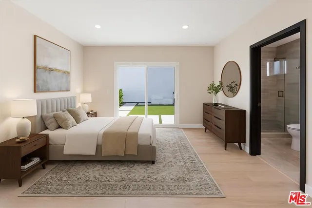 a bedroom with a bed and a painting on the wall