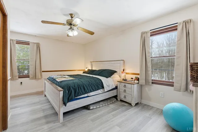 a spacious bedroom with a bed and window