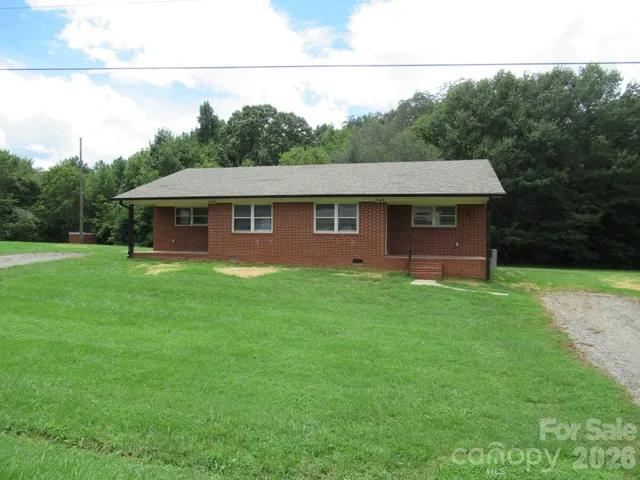 a aerial view of a house with a big yard