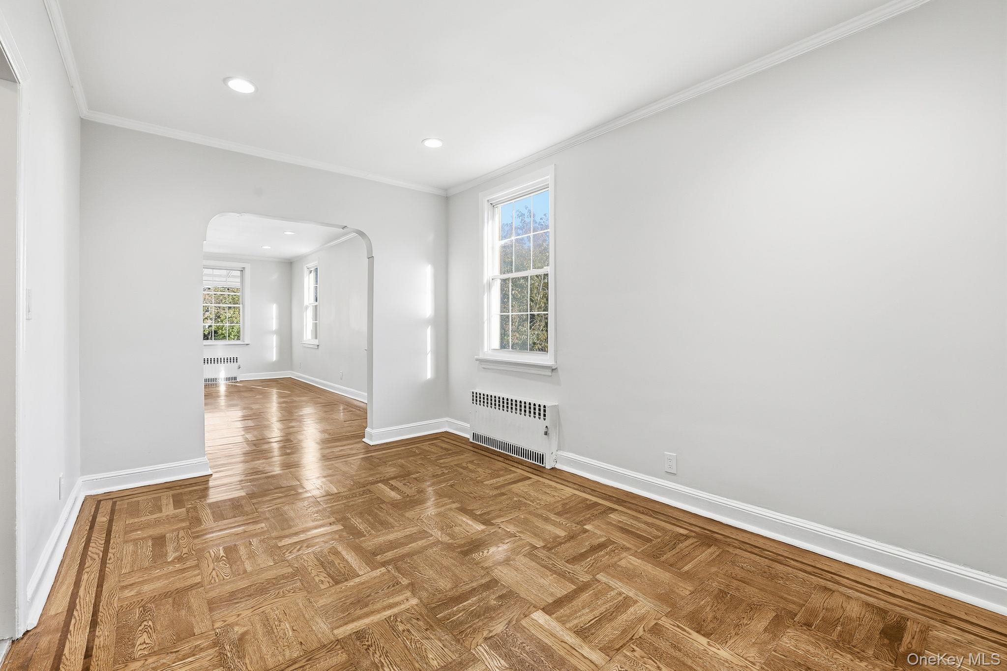 2015 Tenbroeck Avenue Bronx, NY 10461 - Photo 12 of 50 a view of empty room with wooden floor and fan