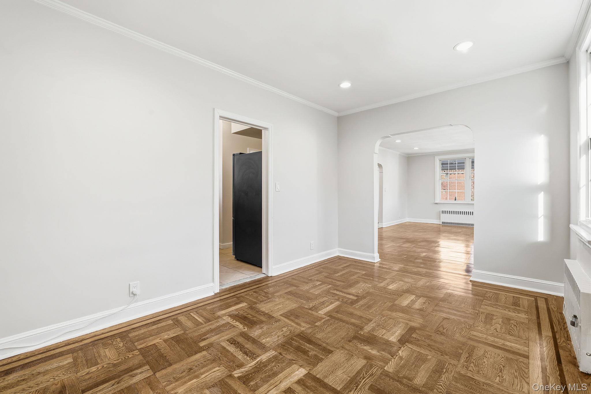 2015 Tenbroeck Avenue Bronx, NY 10461 - Photo 13 of 50 a view of a big room with wooden floor and windows