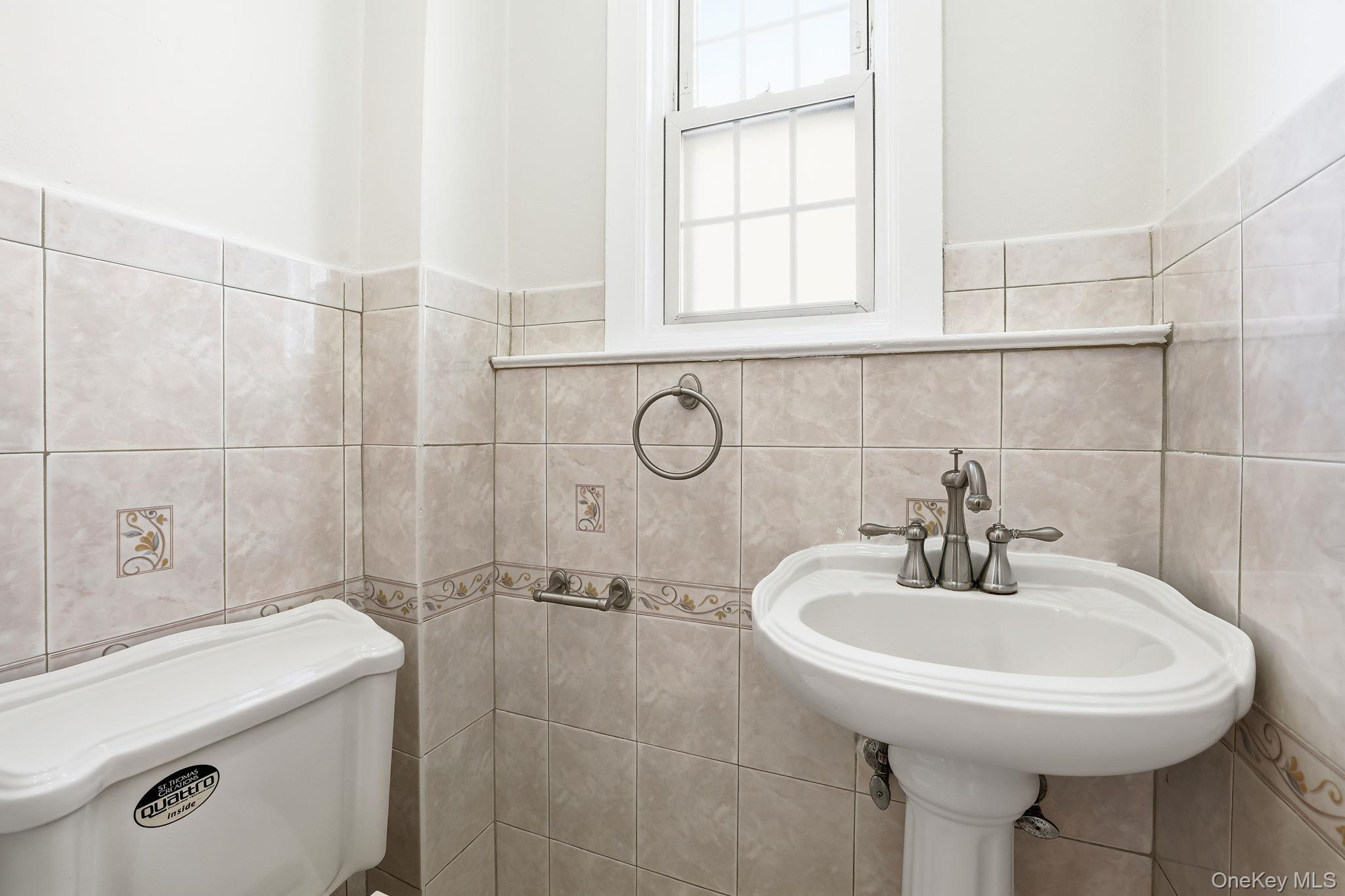 2015 Tenbroeck Avenue Bronx, NY 10461 - Photo 18 of 50 a bathroom with a sink toilet and shower