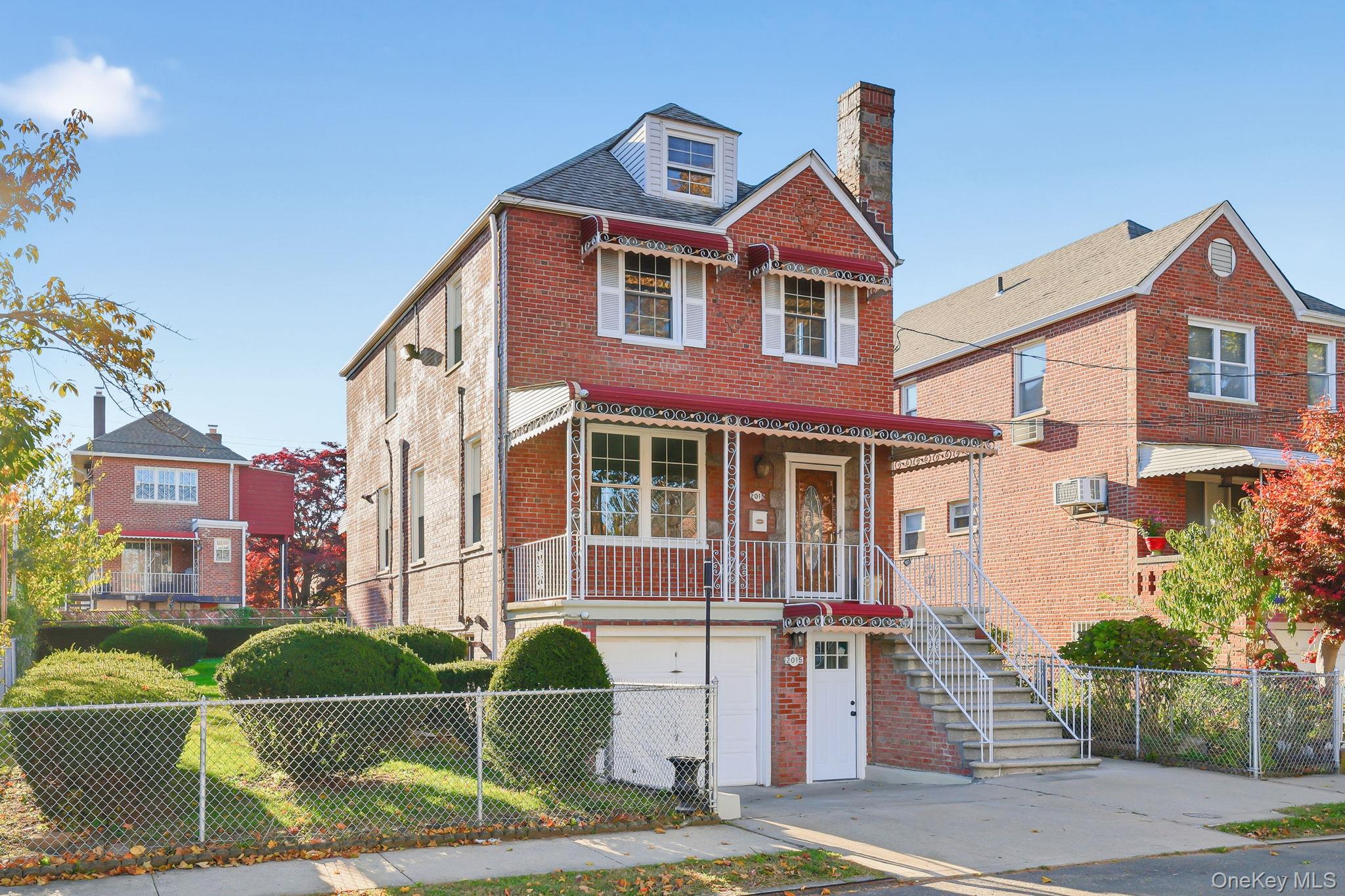 2015 Tenbroeck Avenue Bronx, NY 10461 - Photo 2 of 50 a front view of a house with garden